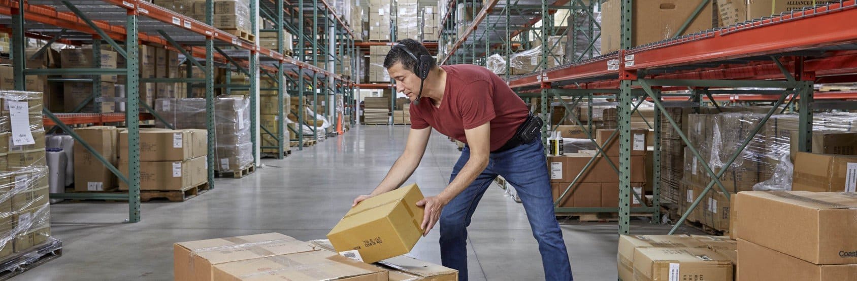 A warehouse worker using a Honeywell voice automated headset