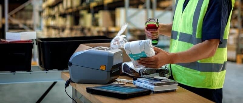 A man using a barcode scanner in the warehouse