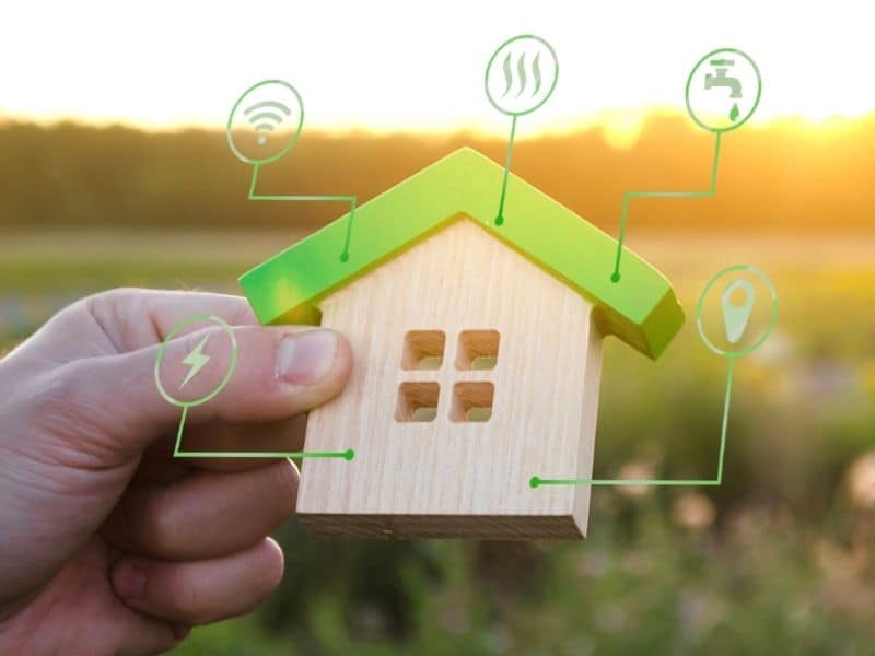 IoT connected house, shown with wooden model and icons